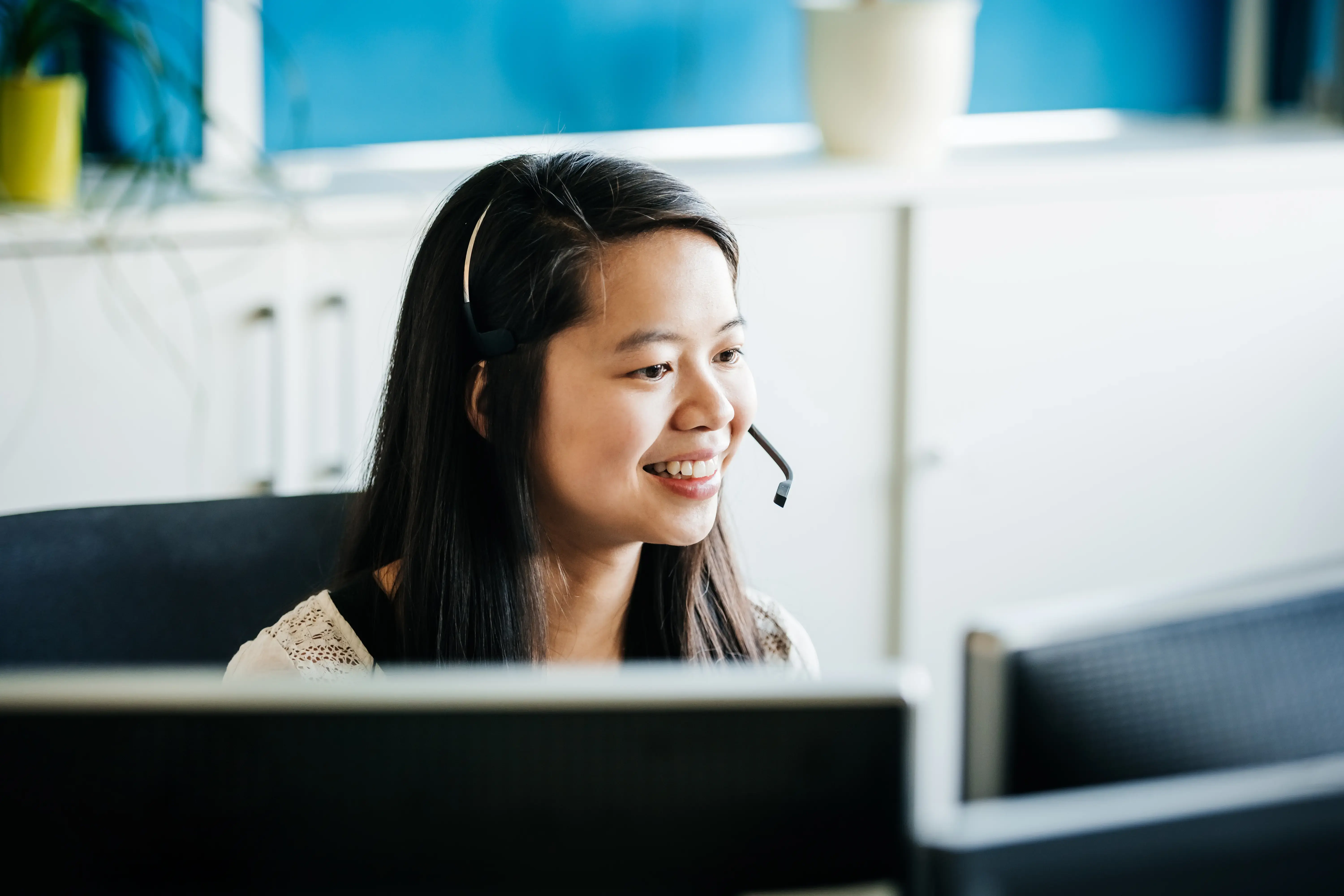 Business Employee Talking To Customer Using Headset